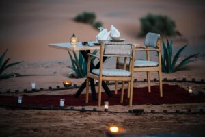 Sunset camel silhouette in the Sahara dunes near Merzouga, Morocco