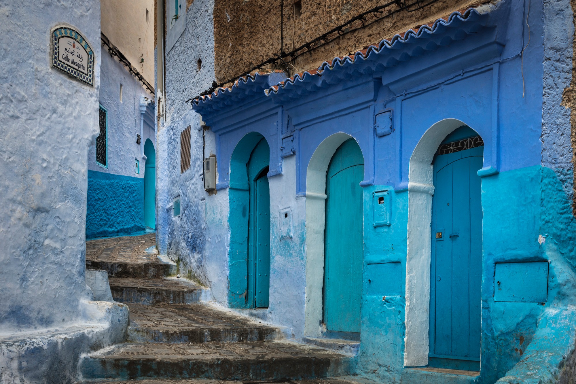 Blue-painted alleyway in Chefchaouen, Morocco