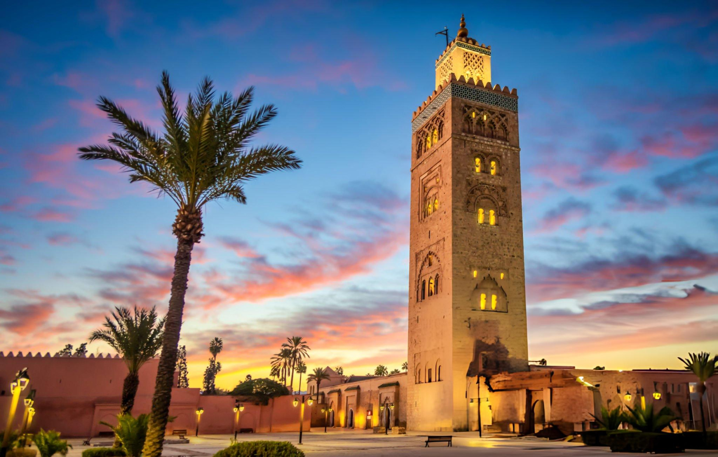 Koutoubia Mosque minaret framed by palm trees in Marrakech, Morocco