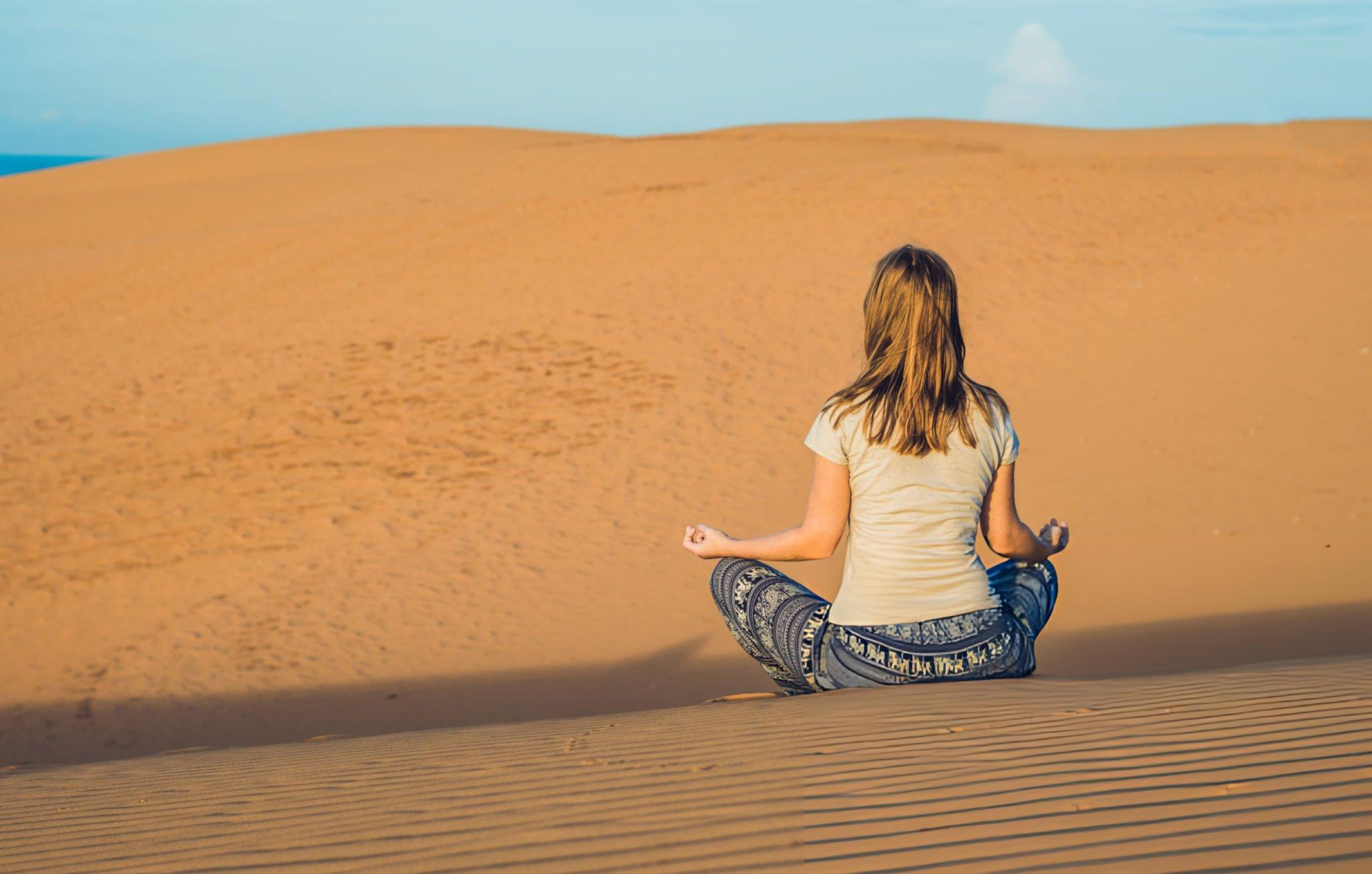 Yoga retreat session on the dunes of the Moroccan desert